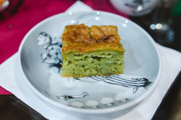 Homemade cake, Vietnamese honeycomb cake ( Banh Bo Nuong) on a festive plate. Freshly baked, warm atmosphere, close-up shot, home setting, traditional pastry, inviting concept, holiday celebration