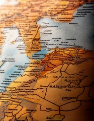 Fototapeta premium Macro map detail shot: countries, rivers, mountain ranges in sharp focus. Captivating cartographic texture. Ideal for travel, history, and background designs