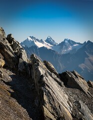 Obraz premium Macro mountain range close-up: sharp, rugged peaks, detailed rocky texture. Captures the raw power and epic scale of nature. Ideal for adventure and landscape backgrounds