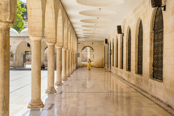 Urfa Sanliurfa Tranquil colonnaded courtyard of a historical mosque. A serene, sun-drenched...