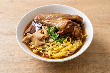 egg noodles with stewed and braised duck in brown soup