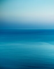 Obraz premium Smooth gradient: deep blue to light teal evokes ocean tranquility. Calming & fluid color wash. Ideal for serene backgrounds & ocean-themed designs.