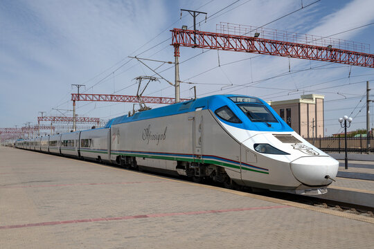 BUKHARA, UZBEKISTAN - SEPTEMBER 11, 2022: High-speed electric train "Afrosiyob" at the platform of the railway station, Bukhara. Republic of Uzbekistan