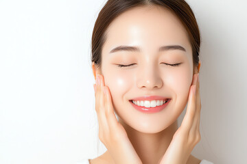 joyful woman with closed eyes smiles while gently touching her face, showcasing radiant skin and serene expression