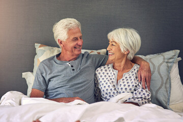 Senior couple, hug and wake up in bed with smile, care and gratitude to start day with love in retirement. Elderly man, woman and embrace with loyalty, trust and support with connection in home