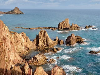Sirens Reef in Cabo de Gata-Níjar. A set of volcanic rocks emerging from the water located in the heart of Cabo de Gata in Almería