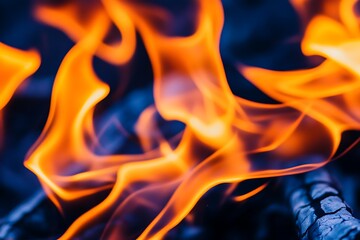 Fire Flames burning with blue wood in the background