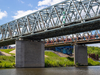 two railways over the river and a passing train