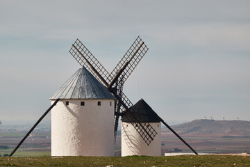 The iconic windmills of Campo de Criptana, famously linked to Don Quixote, standing against the...