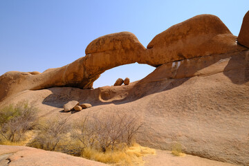 The iconic Spitzkoppe Arch in Damaraland, Namibia, a stunning natural rock formation shaped by erosion over millions of years.