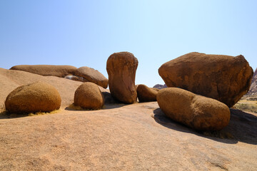 Unique granite rock formations in Damaraland, part of the world's oldest desert, shaped by time and erosion into surreal shapes.
