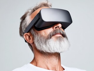 Bearded man wearing virtual reality headset immersed in futuristic digital experience with green screen background