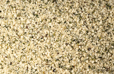 Shelled hemp seeds pile, peeled cannabis grains, marijuana kernels without peel