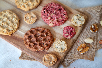 Oat cookies with  nuts and seeds on shadows background