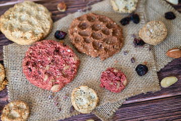 Oat cookies with  nuts and seeds on shadows background