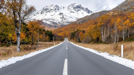 Fototapeta premium Mountain road autumn snow, a scenic drive, leading to peaks