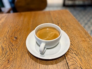 Long shot espresso coffee served at cafe shop