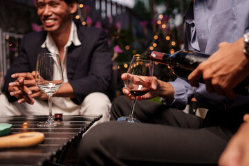 Throw a party Celebrate whiskey at a friendly party in a restaurant. Night.