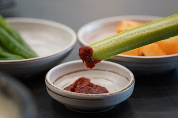 Korean food culture of eating cucumbers dipped in gochujang