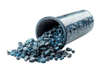 Colored stones spilling from a container in a clean, bright setting ideal for decorative use or crafts