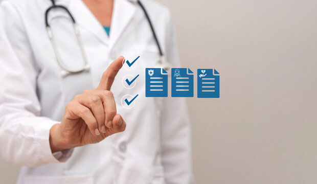 Close up of Doctor using virtual interface selecting medical insurance, patient records and healthcare plans