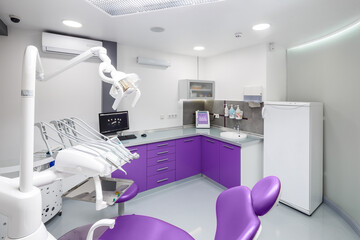 Modern Dental Clinic Interior with a Comfortable Treatment Chair and High-Tech Equipment for Patient Care and Oral Hygiene Services