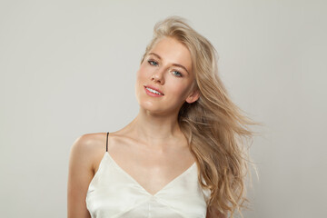 Beautiful blond woman with cute smile looking at camera. Beauty young adult person portrait