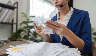 Accountant analyzing tax documents and financial paperwork in office