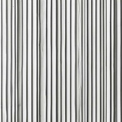 Obraz premium White corrugated paper with a fluted texture is a material that combines sophistication and originality. Its surface, covered with fine waves, creates an interesting visual effect.