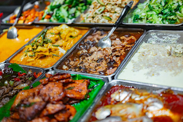 Traditional Asian dishes sold in a food court in Singapore