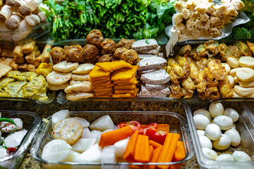 Traditional Asian dishes sold in a food court in Singapore