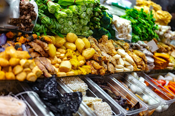 Traditional Asian dishes sold in a food court in Singapore