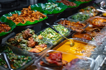 Traditional Asian dishes sold in a food court in Singapore