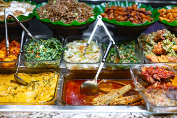 Traditional Asian dishes sold in a food court in Singapore