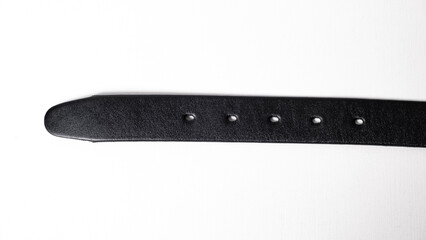 Black Classic leather Belt isolated on white background close-up. Five holes to adjust the waist size.
