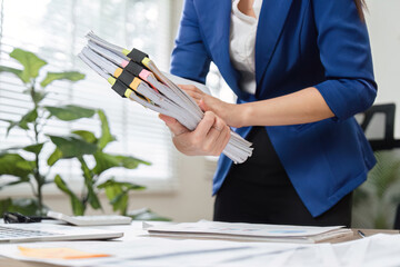Close-up of accountant organizing tax documents in a professional office