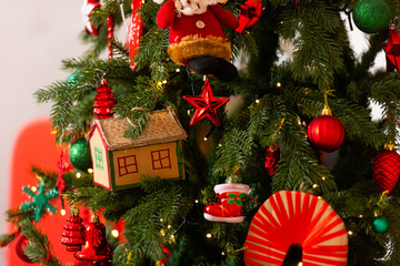 New Year's toys on the Christmas tree made by yourself. Christmas decorations made from cardboard.