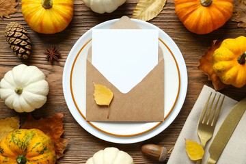 Rustic holiday table setup. Top view with plates, cutlery and autumn decorations. Empty space for your text 