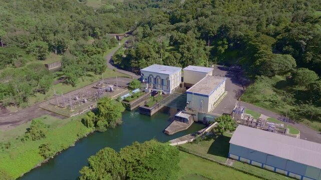 Aerial top down shot of HYDROELECTRIC dam in Nature of Dominican Republic. Sunny day with barrier architecture.