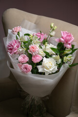 Delicate composition of white and pink roses in a basket