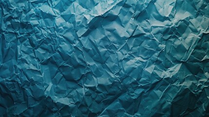 Obraz premium Crumpled blue paper texture creating an abstract background for artistic or design purposes
