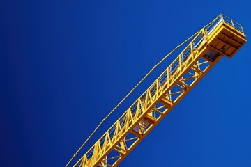Yellow Construction Crane Against Vibrant Blue Sky Background