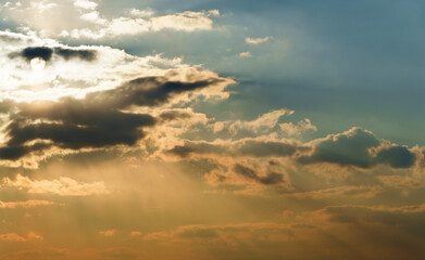beautiful and dramatic sunset sky with bright yellow clouds as abstract background