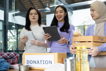 Group of women joyfully managing a donation drive