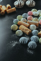 Colorful Marshmallows and Wafers on Dark Background