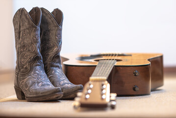 cowgirl embroidered boots and acoustic guitar - text space on top - country line dance