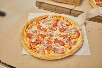 a professional chef assembles and cooks a delicious pizza.