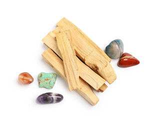 Palo santo sticks and gemstones isolated on white, top view