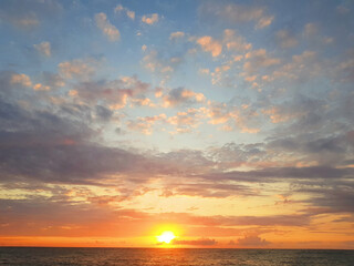 Sunset on sea beach. Beautiful nature background. Sky, clouds and sun light