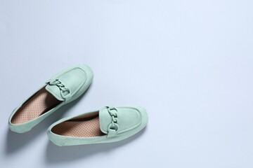 Pair of stylish shoes on white background, flat lay. Space for text